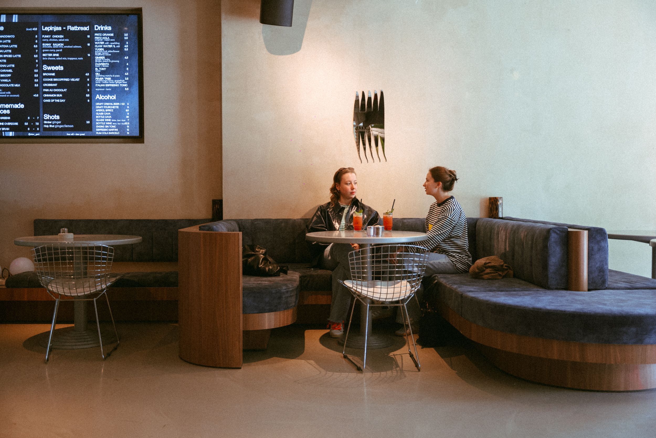 The booth and tables inside Claw by day